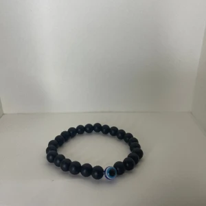 Svart pärlarmband med öga - Oanvänt skick 5/5 Nypris: 299kr Onesize