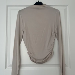 Topp från gina - En beige/rosa topp från gina