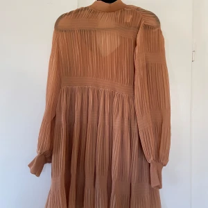 Smockad tunika - Tunika frm hm  Lös passform, kortare modell  Endast använd en gång