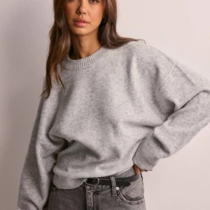 Stickad tröja - Stickad tröja från Nelly. Endast använd några gånger. Perfekt till hösten🩵