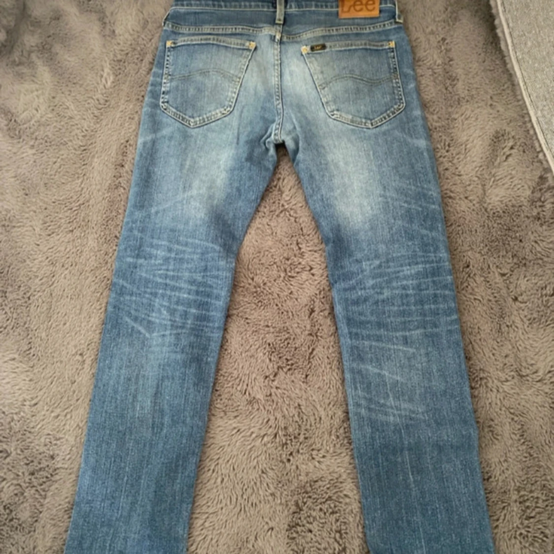 Blå slitna jeans från Lee - 1