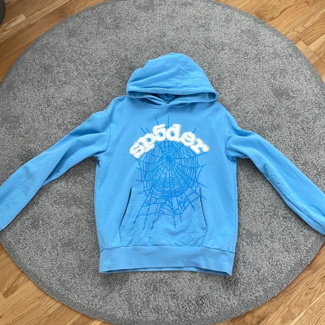 Blå hoodie från Spyder med tryck