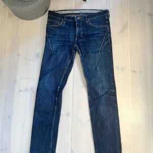 Number (N)ine pain jeans - Number (N)ine jeans Actual size (laid flat) Waist: Approx. 39cm (stretches to 39.5cm) Rise: Approx. 21.5cm Inseam: Approx. 75.5cm  Thigh width: Approx. 24.5cm Hem width: Approx. 14.5cm Hips: Approx. 43cm