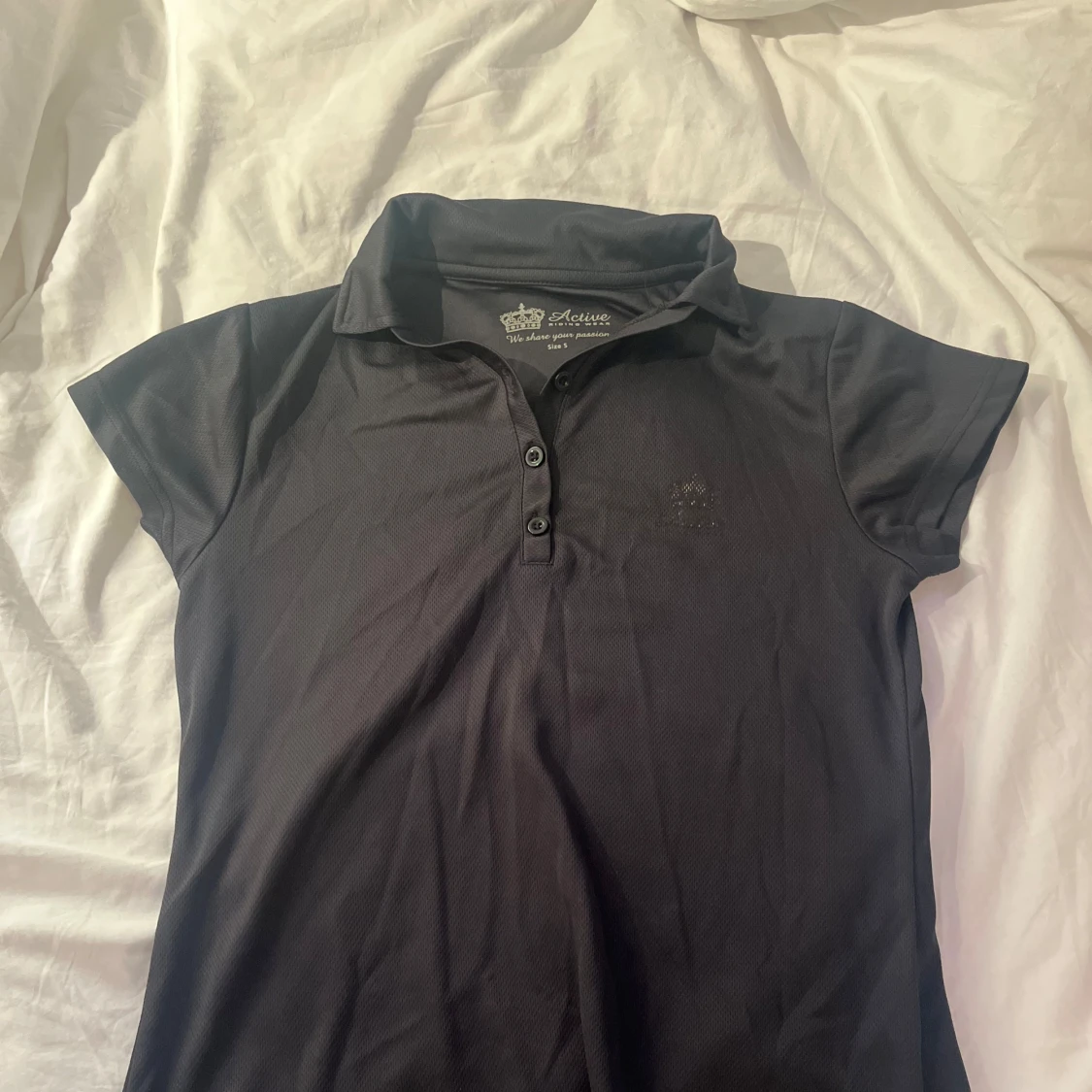 Svart polotopp från Active Riding Wear