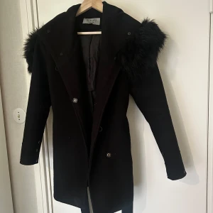 Hollies kappa  - Hollies kappa använd en vinter, nypris 1600kr
