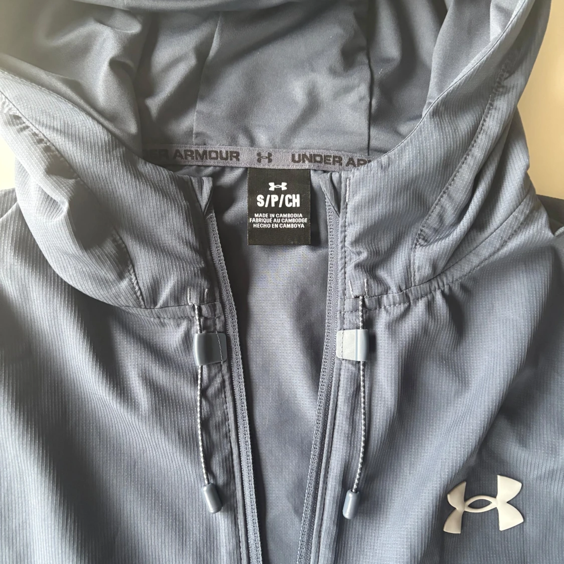 Blå/grå vindjacka från Under Armour stl S - 1