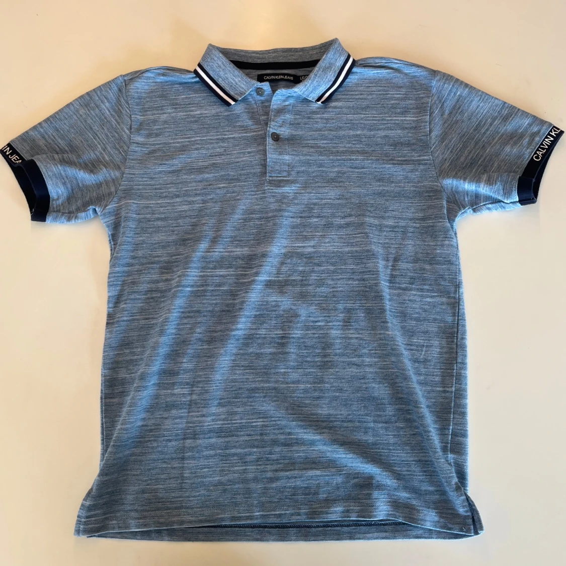 Blå pikétröja Calvin Klein Jeans