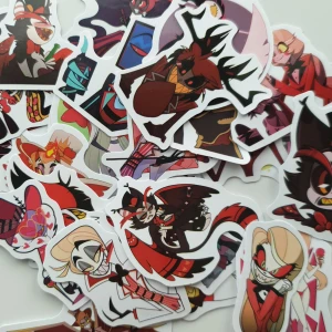 25st Hazbin Hotel Stickers - Ett färgstarkt set med stickers från Hazbin Hotel, fyllda med unika och uttrycksfulla karaktärer i cool tecknad stil. Perfekt för att dekorera laptop, mobil eller anteckningsbok och visa din kärlek till serien. Passar dig som gillar edgy och kreativ popkultur!