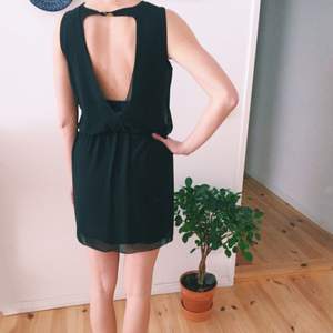 Your perfect little black dress from Zara. 2 layered, 1 spandex dress, and a loose layer on top. V-neck both in front & back. ONLY WORN ONCE. Good as new.