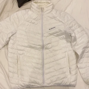 Marine White down - Blue stains on its hem but not so obvious