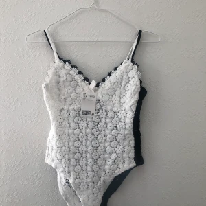 h&m body  - Two new bodies (white and black) size S. 