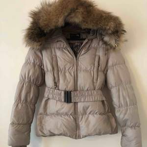 Hollies winter puffer Jacket with a real fur good!  Size 38 and in excellent condition.