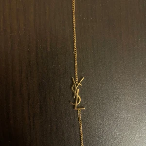 ysl armband  - digitalt kvitto finns 
