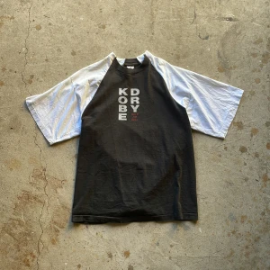 Reworked Raglan Tee - Crafted from a trio of vintage T-shirts, expertly combined in the timeless raglan cut, each shirt thoughtfully selected to form this unique piece.