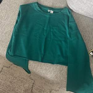 Grönt tröja som aldrig använts 