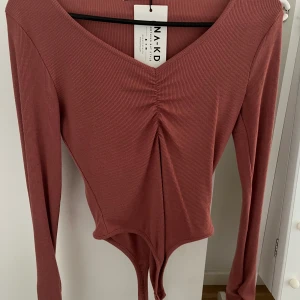 Body - Superfin body från nakd aldrig använd !