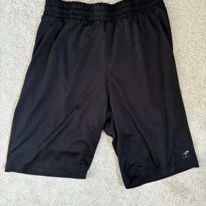 Black shorts - This item has only been worn a few times and is in almost perfect condition. It has been taken care of very carefully and aiso been washed very thoroughly, so it is definitely not dirty.
