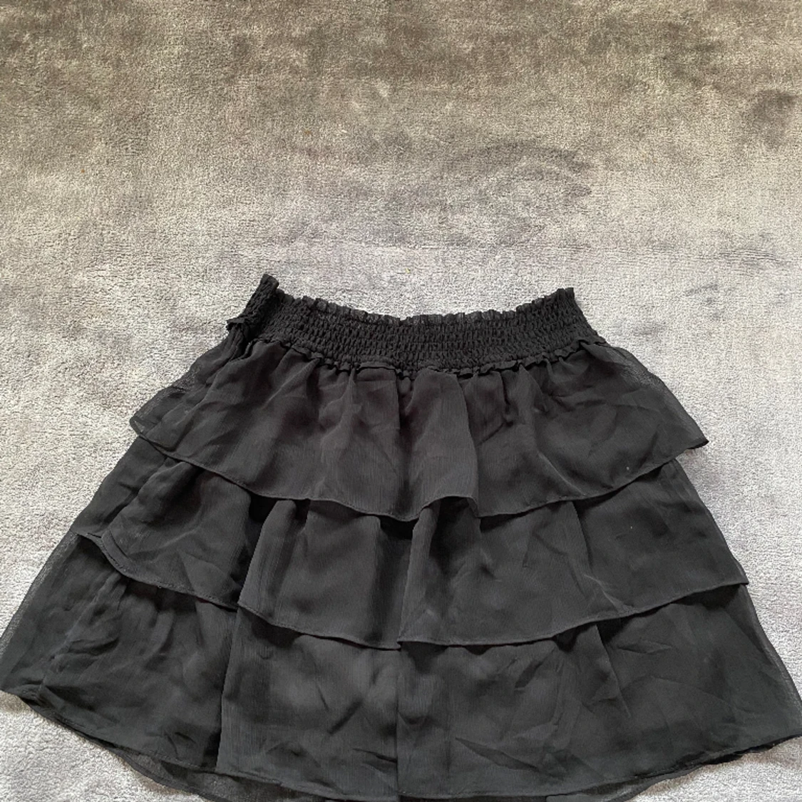 Svart minikjol strl S