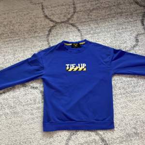 Selling a blue sweater.
