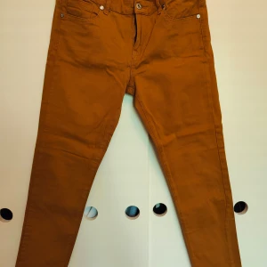 Orange chino - Very good condition Waist 40 cm Length 90 cm 