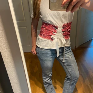 Korsett bälte mönstrad - As cool mönstrad korsett bälte med snörning med satin tråd  Passar storlek xs-m