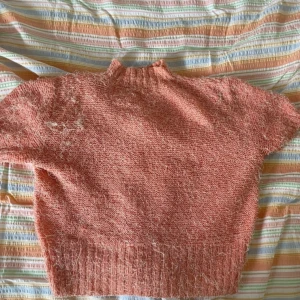 Stickad polo - Lite croppad, inget märke storlek M-L