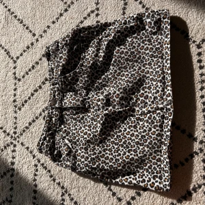 cheetah denim mini skirt  - rarely worn. fits sizes XXS, XS