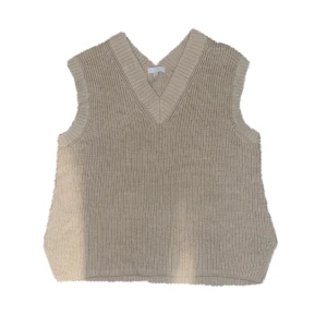 Beige väst - Beige stickad väst med inga skador 
