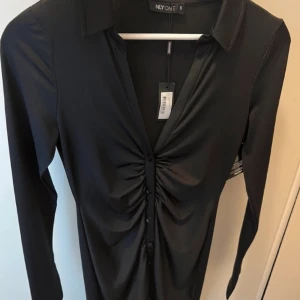 Klänning  - Aldrig använd och därav i nytt skick 