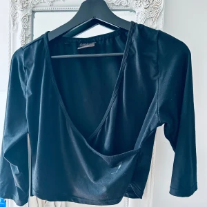 Träningstopp Gymshark  - Omlott topp Gymshark Sorlek M Svart 