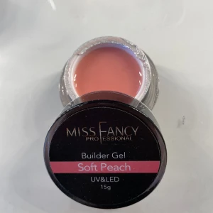 Builder gel Miss Fancy  - Nagel gelé från Miss Fancy i färger ”soft peach” och storleken 15g. Endast testad, så hela burken kvar. Den har låg viskotet så den jämnar ut sig fint. Köpt för 269kr. Säljer för 200kr. Hör av dig om du har frågor eller för fler bilder!