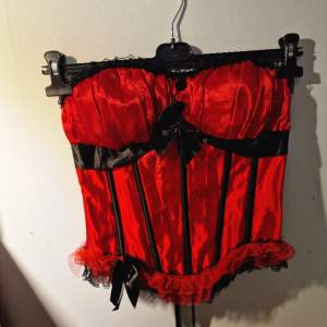 Red corset from beyond retro • Black and red • Black lace and bows • Zipper on the side • Price is negotiable