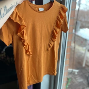 Topp med volang - Utan anmärkning 