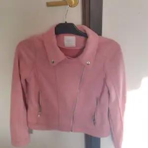En jacka från Lindex, använts några gånger. En fin rosa jacka.