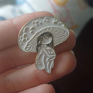 enamel pin badge of mushroom girl, bought at malmö scifi con 2023 