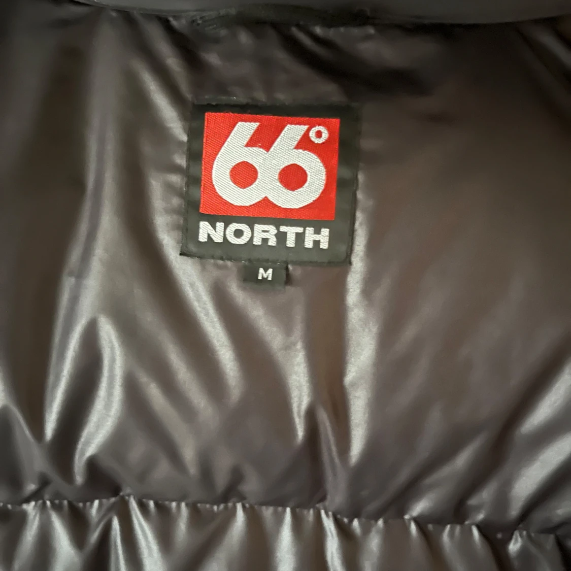 Svart pufferjacka från 66° North - 91