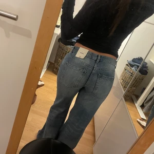 Lågmidjade jeans - Lågmidjade vida jeans, storlek 34/XS
