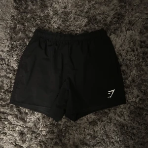 Svarta träningsshorts från Gymshark - Ett par svarta träningsshorts från Gymshark i storlek XS. I ett bra skick. Hör av dig vid funderingar.