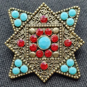 Brosch - Läcker stjärna - Den här broschen i form av en stjärna är ca 5 × 5 cm.