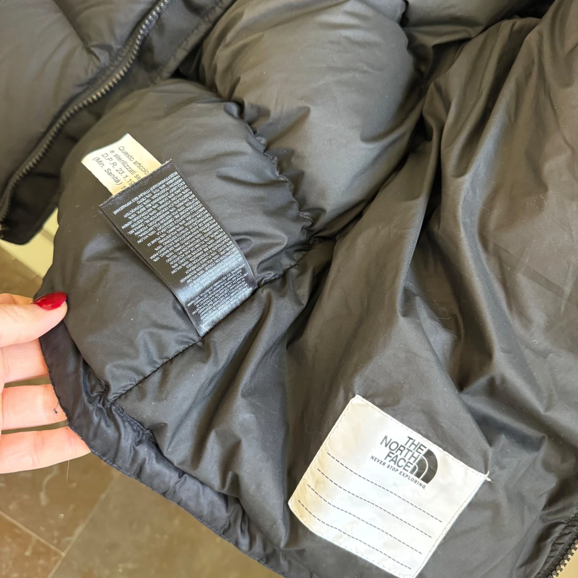 The North Face svart dunjacka.  - 91