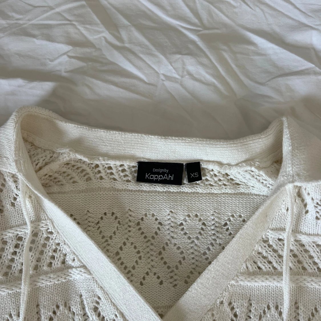 En virkad vit tröja  - 91
