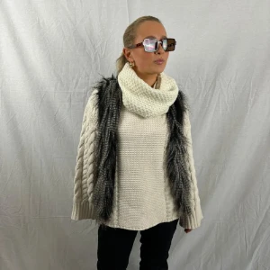 Grå pälsväst - Snygg grå pälsväst som är perfekt till afterski.