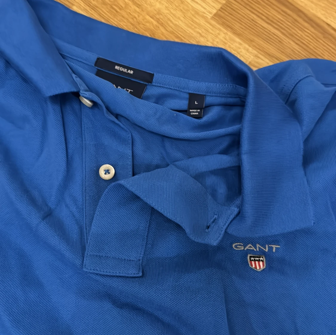 Blå pikétröja från GANT - 90