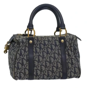 Christian Dior Mini Boston väska - Upprinnelse: Italia Material: traver lerret    Tillbehör: nyckel, lås och garantikort    Utsida: Bra stand, med några små bruksmärker.  Innehåll: Bra stand, med några små bruksmärker. B 25cm x H 15cm x D 15cm