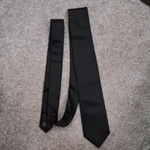Svart slips - En vanlig svart slips som inte används
