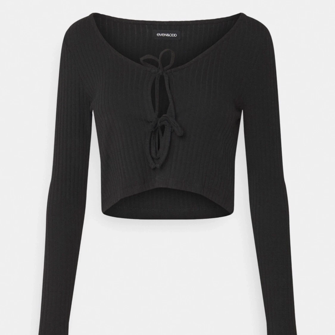 kofta med knytdetaljer