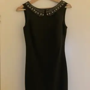 Size small, short dress with V on its back. In very good condition