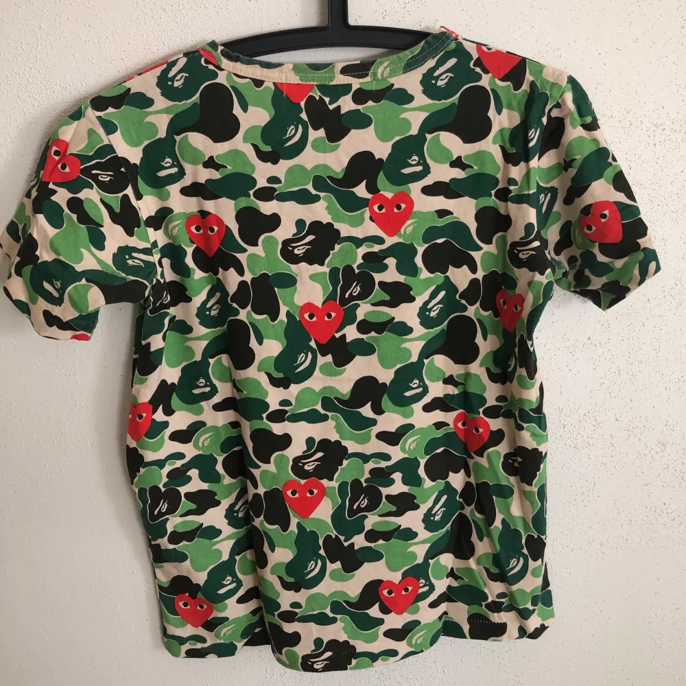 Women’s CDG Play / Comme Des Garçons x Bape T-Shirt  Size small, women’s fit.  Great condition, no flaws or damage.  DM if you need exact size measurements.   Buyer pays for all shipping costs. All items sent with tracking number.   No swaps, no trades, no offers. . T-shirts.