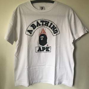 Bape / A Bathing Ape x Travis Scott 10th Anniversary T-Shirt  Size medium, fits like a regular men’s small. Great condition, no flaws or damage.  DM if you need exact size measurements.   Buyer pays for all shipping costs. All items sent with tracking number.   No swaps, no trades, no offers. 