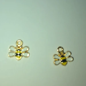 Bin belocker - Den e 3 millimeter gul o svart man kan ha den till halsband armband och är örhängen 